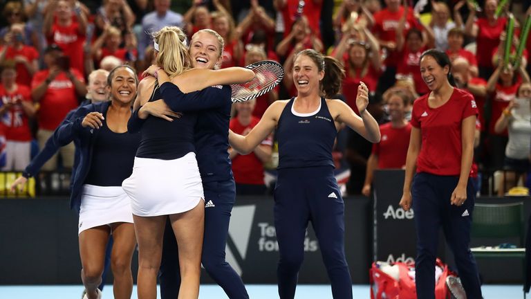 Katie Boulter of Great Britain celebrates defeating Zarina Diyas of Kazakhstan with team mates as they won the tie during the Fed Cup World Group II Play-Off match between Great Britain and Kazakhstan at Copper Box Arena on April 21, 2019 in London, England.