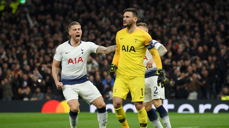 Spurs goalkeeper Hugo Lloris is congratulated by Toby Alderweireld after saving Sergio Aguero's penalty