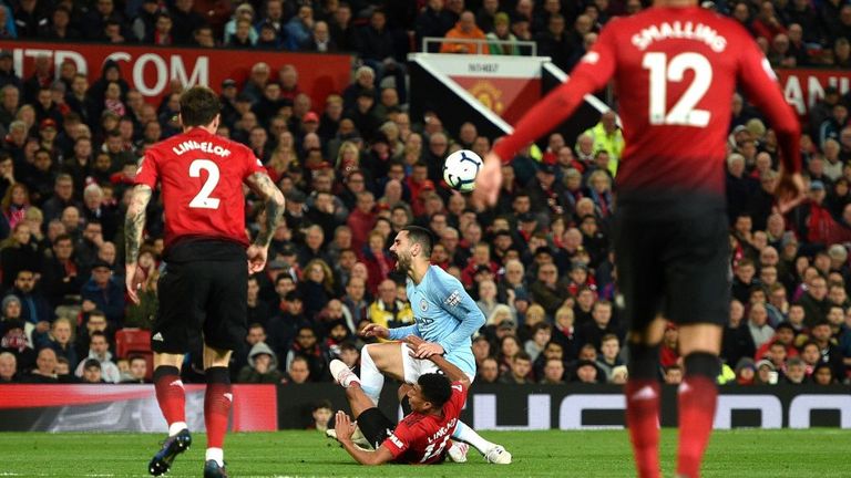 Ilkay Gundogan clashes with Jesse Lingard at Old Trafford