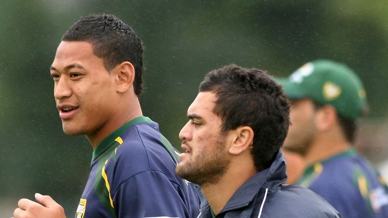 BRISBANE, AUSTRALIA - NOVEMBER 18:  (L-R) Israel Folau and Karmichael Hunt of the Kangaroos warm up during an Australian Kangaroos training session at Langlands Park on November 18, 2008 in Brisbane, Australia.  (Photo by Bradley Kanaris/Getty Images)