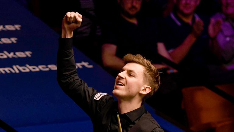 James Cahill celebrates following his win against Ronnie O'Sullivan in the opening round of the world snooker championship at Crucible Theatre on April 23, 2019 in Sheffield, England. 