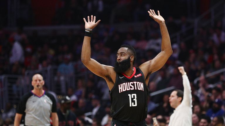 James Harden #13 of the Houston Rockets celebrates after a dunk by Clint Capela #15 against the Los Angeles Clippers during the first half at Staples Center on April 03, 2019 in Los Angeles, California.