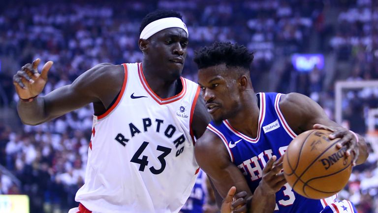 Jimmy Butler #23 of the Philadelphia 76ers dribbles the ball as Pascal Siakam #43 of the Toronto Raptors defends during Game One of the second round of the 2019 NBA Playoffs at Scotiabank Arena on April 27, 2019 in Toronto, Canada