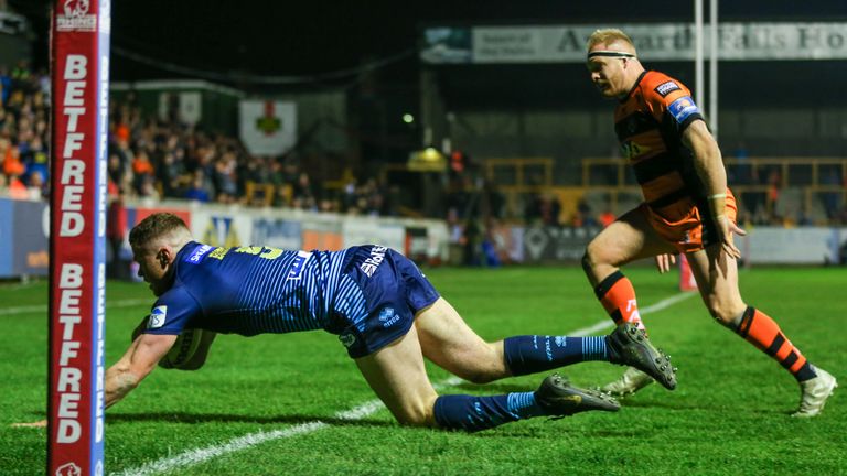 Joe Burgess scores a try during a period of dominance for Wigan in the first half