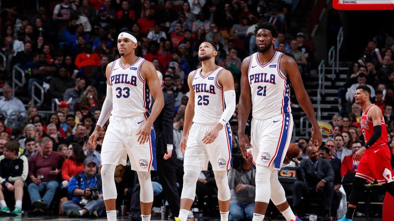 Tobias Harris #33, Ben Simmons #25, Joel Embiid #21 of the Philadelphia 76ers look on during the game against the Chicago Bulls on April 6, 2019 at United Center in Chicago, Illinois.