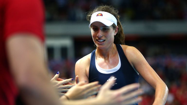 Johanna Konta of Great Britain celebrates with team mates after winning her first singles match against Kazakhstan Zarina Diyas during the Fed Cup World Group II Play-Off match between Great Britain and Kazakhstan at Copper Box Arena on April 20, 2019 in London, England. 