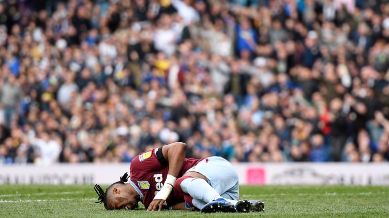 Jonathan Kodjia lay on the ground injured as Leeds controversially continued to play on