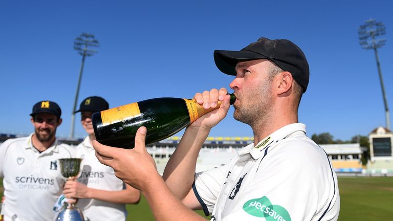 Trott celebrates Warwickshire winning the Division Two title against Kent at Edgbaston last September