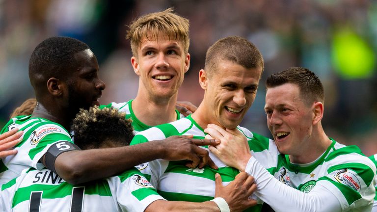 Jozo Simunovic celebrates with team-mates after scoring Celtic's opener