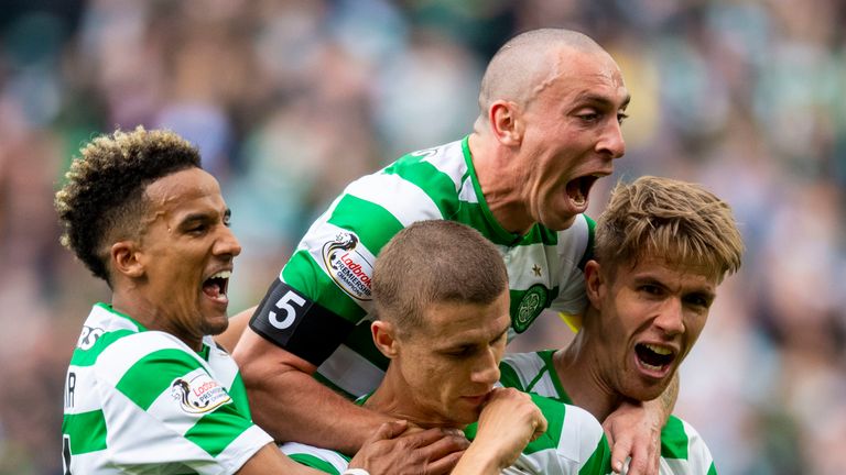 Jozo Simunovic celebrates with team-mates after putting Celtic 1-0 up