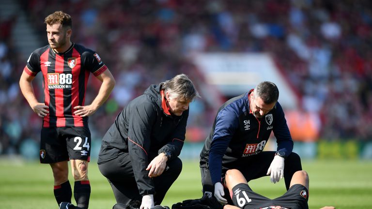 Bournemouth winger Junior Stanislas receives treatment against Fulham