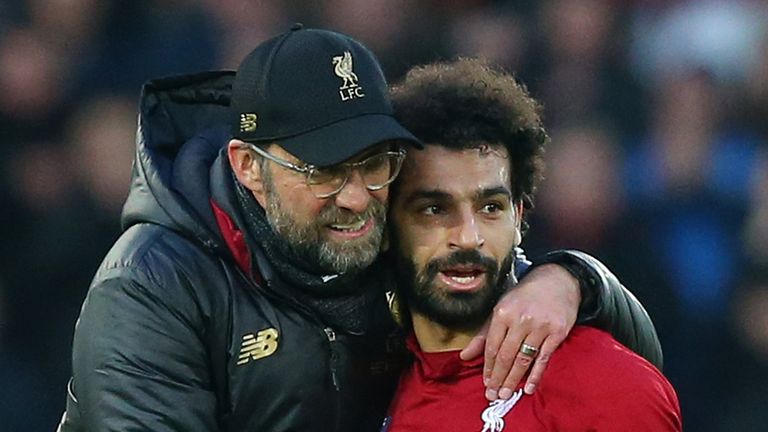 Jurgen Klopp, Manager of Liverpool celebrates victory with Mohamed Salah of Liverpool after the Premier League match between Liverpool FC and AFC Bournemouth at Anfield on February 9, 2019 in Liverpool, United Kingdom.