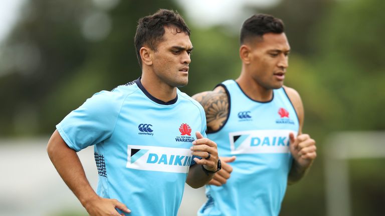 Karmichael Hunt and Israel Folau run during a Waratahs Super Rugby training session at David Phillips Sports Complex on March 25, 2019 in Sydney, Australia. 