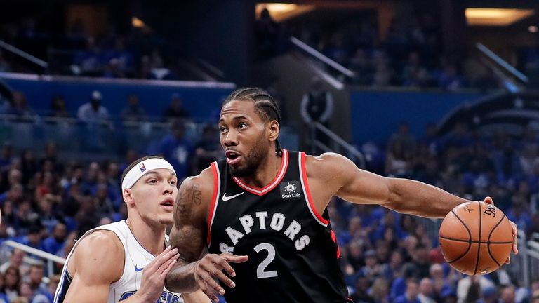 Kawhi Leonard #2 of the Toronto Raptors is defended by Aaron Gordon #00 of the Orlando Magic during Game Four of the first round of the 2019 NBA Eastern Conference Playoffs at the Amway Center on April 21, 2019 in Orlando, Florida.