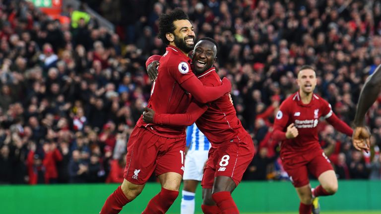 Liverpool pair Mo Salah and Naby Keita embrace after their first goal against Huddersfield.