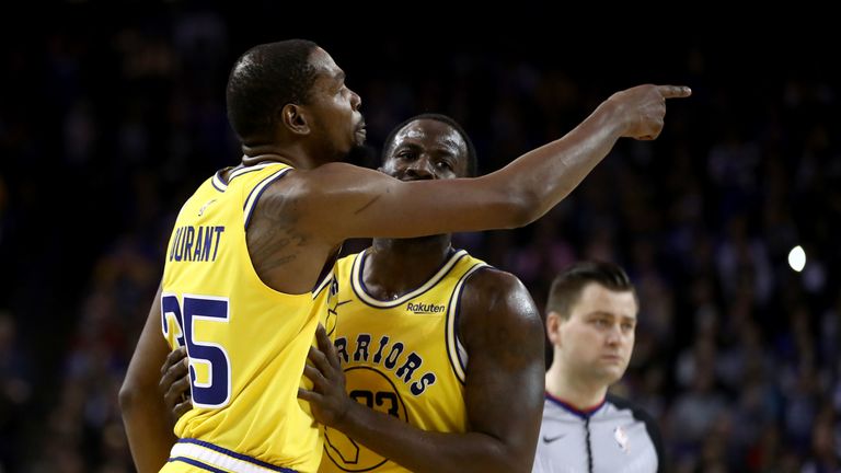 Kevin Durant #35 of the Golden State Warriors is held back by Draymond Green #23 after Durant was ejected from the game for complaining about a call during their game against the Denver Nuggets at ORACLE Arena on April 02, 2019 in Oakland, California.