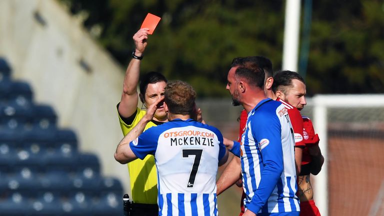 Referee Steven McLean brandishes his third red card of the afternoon, this time to Kilmarnock's Rory McKenzie 