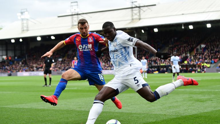 Kurt Zouma attempts to clear the ball under pressure from James McArthur