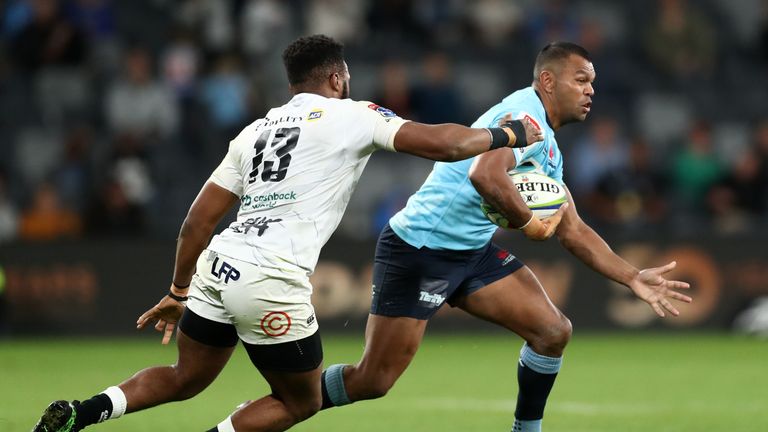 Kurtley Beale of the Waratahs attacking against the Sharks in Super Rugby