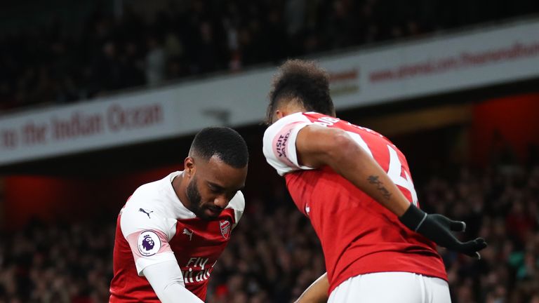 Alexandre Lacazette celebrates with Pierre-Emerick Aubameyang