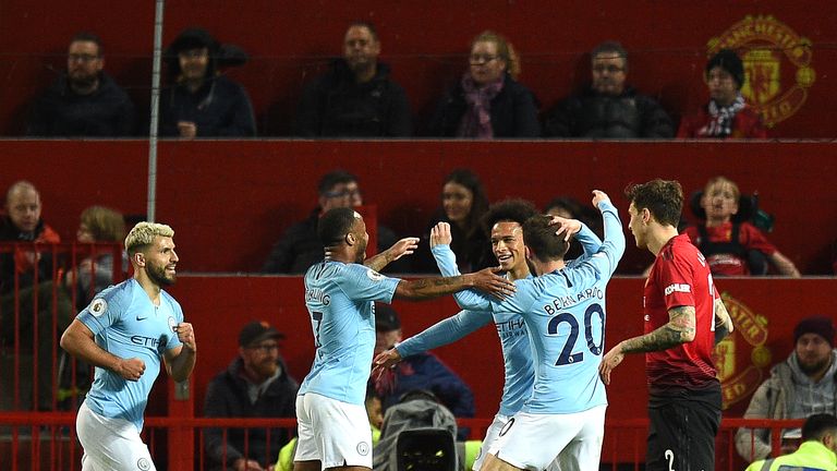 Leroy Sane celebrates with his Man City team-mates after coming on to double their lead