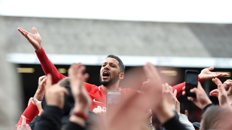 Leyton Orient captain Jobi McAnuff celebrates promotion to the Football League