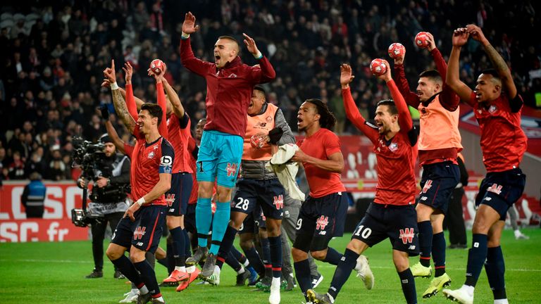 Lille players celebrate their 5-1 win against PSG