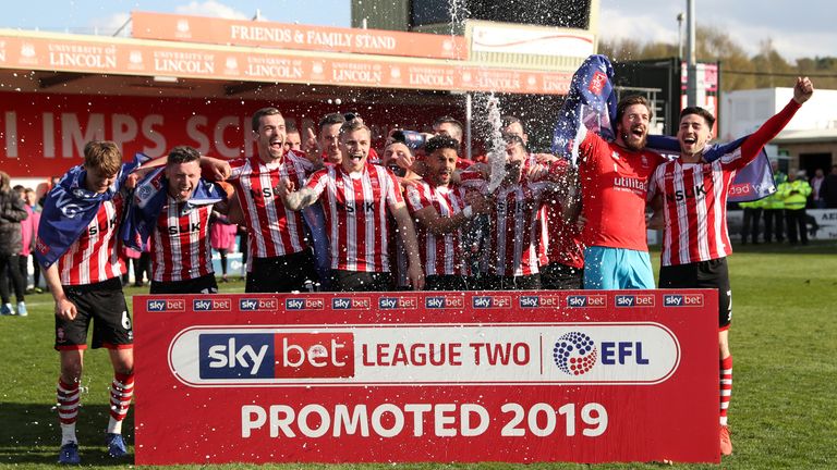 Lincoln celebrate winning promotion from Sky Bet League Two