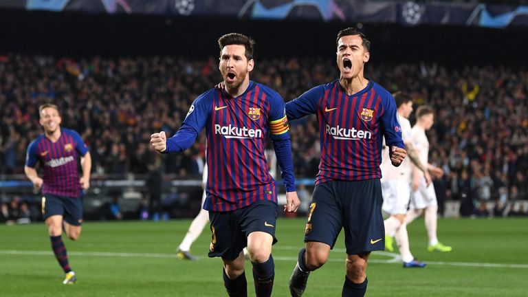 Lionel Messi celebrates scoring his first goal against Manchester United with Barcelona team-mate Philippe Coutinho