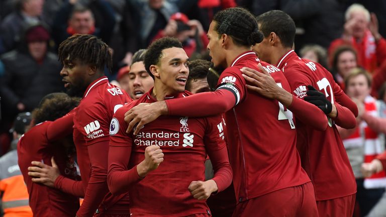 Liverpool celebrate after their late winner against Tottenham.