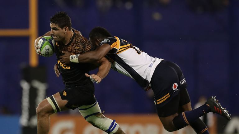 Los Jaguares' flanker Pablo Matera looks to evade the clutches of Brumbies centre Tevita Kuridrani