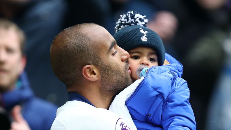 Lucas Moura celebrates with his son Miguel at full-time