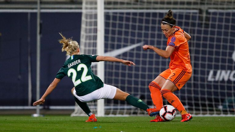  Pernille Harder of Wolfsburg challenges Lucy Bronze of Lyon during the UEFA Women's Champions League: Quarter Final Second Leg match between Wolfsburg and Lyon at AOK Stadion on March 27, 2019 in Wolfsburg, Germany. 