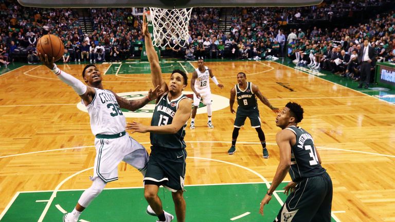 Marcus Smart #36 of the Boston Celtics takes a shot against Malcolm Brogdon #13 of the Milwaukee Bucks in Game Seven of Round One of the 2018 NBA Playoffs at TD Garden on April 28, 2018 in Boston, Massachusetts.