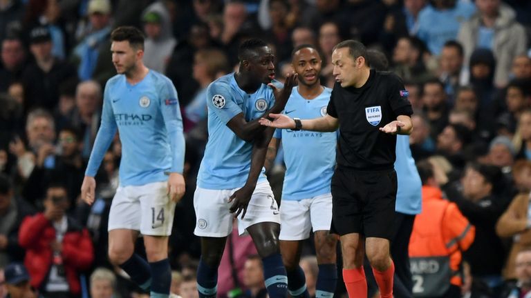 Man City players protest with referee Cuneyt Cakir