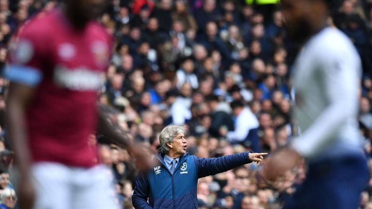 Manuel Pellegrini gestures from the touchline at Tottenham Hotspur Stadium during West Ham's match with Spurs