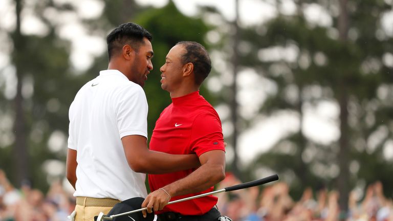 Tony Finau congratulates Tiger Woods on his Masters victory