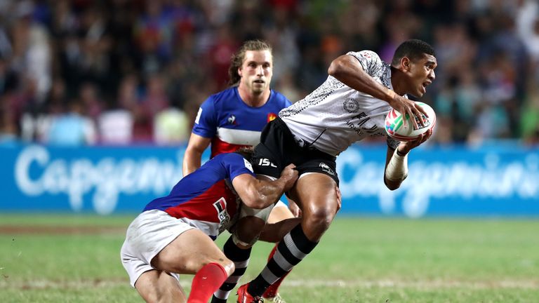 Meli Derenalagi of Fiji charges forward against France 