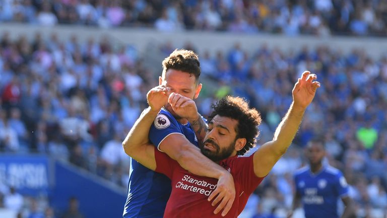Mohamed Salah wins a penalty after a challenge from Sean Morrison