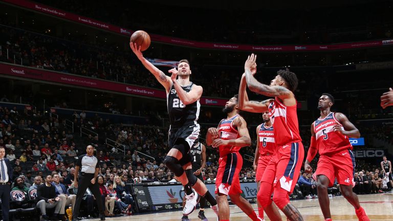 Donatas Motiejunas of the San Antonio Spurs shoots the ball against the Washington Wizards