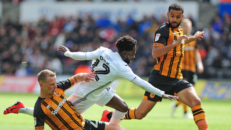 Nathan Dyer of Swansea City is tackled by Stephen Kingsley of Hull City
