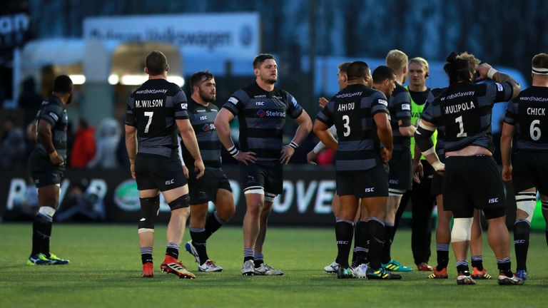 Newcastle Falcons players look dejected after losing to Northampton