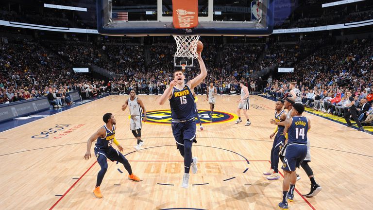 Nikola Jokic #15 of the Denver Nuggets drives to the basket during the game against the San Antonio Spurs on April 3, 2019 at the Pepsi Center in Denver, Colorado.