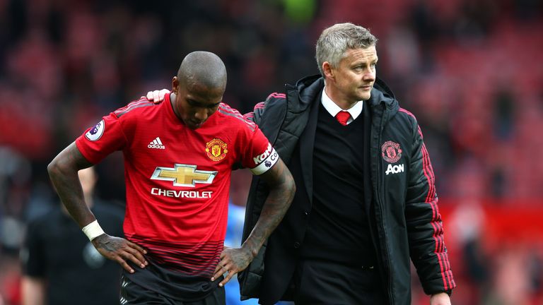 Ole Gunnar Solskjaer consoles Ashley Young following the 1-1 draw with Chelsea