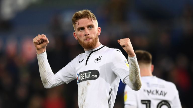 Oli McBurnie celebrates scoring for Swansea against Stoke