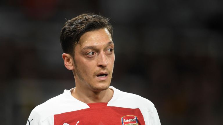 Ozil appeared to throw his coat at Marco Silva