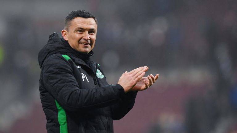Hibernian manager Paul Heckingbottom applauds the fans at full time
