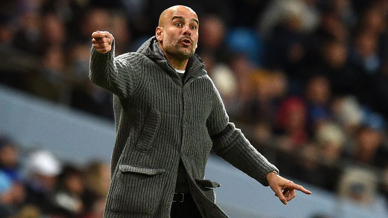 Pep Guardiola gestures on the touchline during Manchester City&#39;s match vs Cardiff