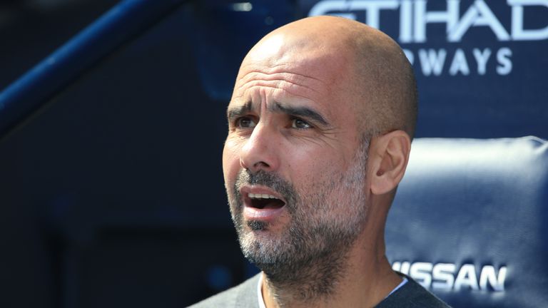 Pep Guardiola looks on during Manchester City's win over Tottenham