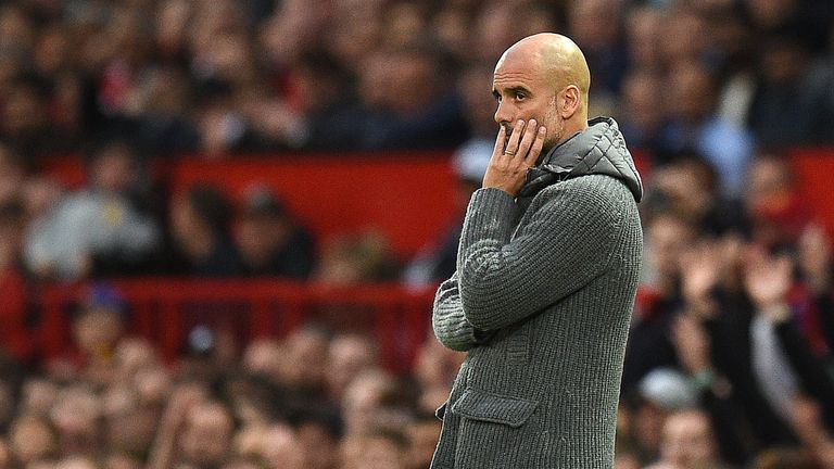 Pep Guardiola looks on from the touchline at Old Trafford